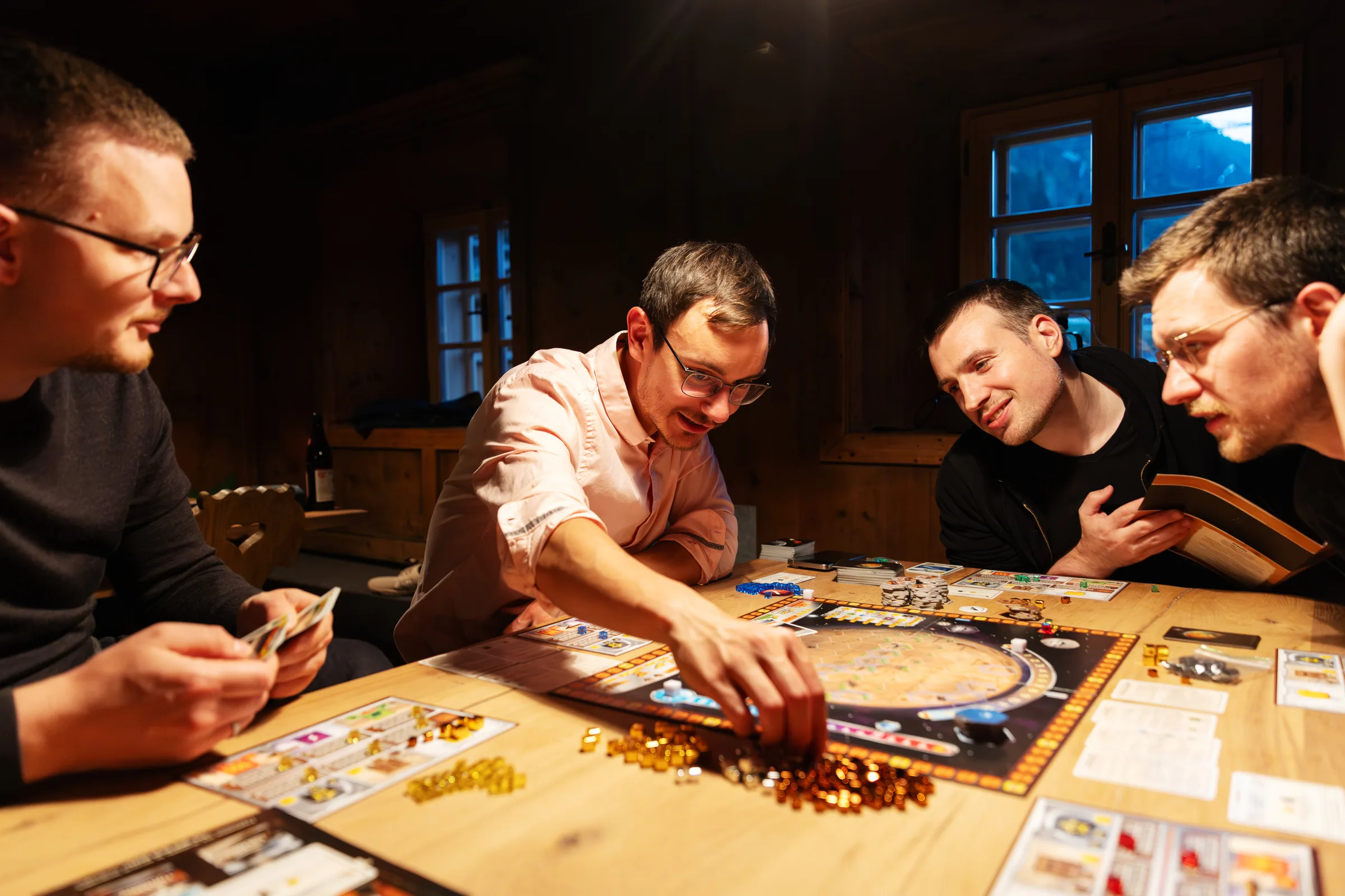 codejoi team members playing a board game together during an offsite